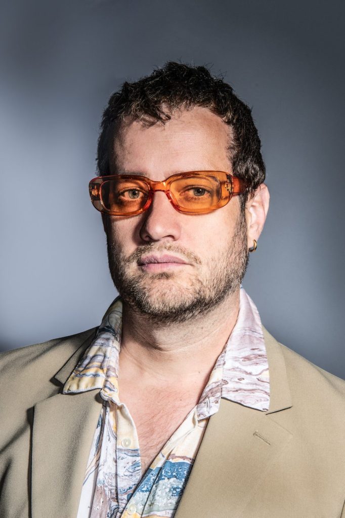 Portrait of Robin Clyfan in orange-tinted glasses