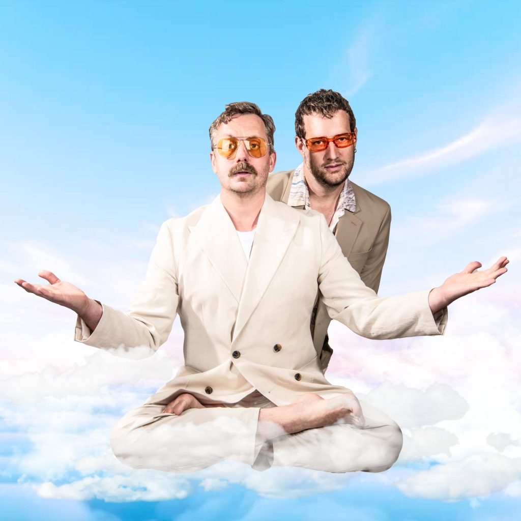 Robin Clyfan and Charlie Partridge as Rogers Velvet Rendez Vous, floating cross-legged on a cloud
